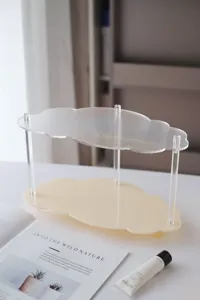 Clear acrylic cloud shaped two tier storage rack for desktop cosmetics and perfume display.