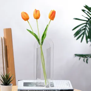Clear acrylic arched flower vase modern minimalist decorative floral vessel for home decor.