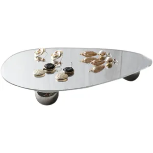 Irregular mirror jewelry tray with spherical feet, perfect for displaying earrings and small accessories.