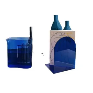Blue acrylic desktop organizer set, modern minimalist bookend and pen cup for office storage.