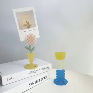 Acrylic flower photo clip detail featuring cute transparent material in a desktop display scene.