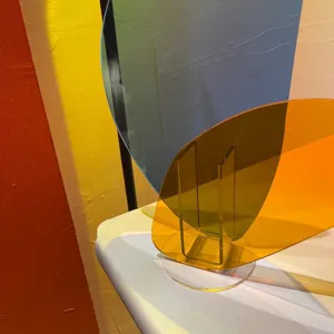 Close-up detail of geometric acrylic decorative vase, colorful transparent panels aesthetic.