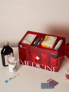 Red transparent acrylic medicine storage box with compartments and handle for home emergency.