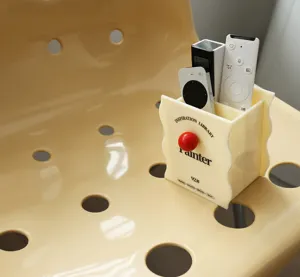 Detail shot of creative acrylic desktop pen holder and remote control storage box in cream white.