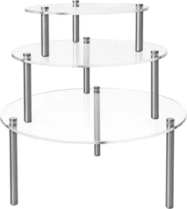 3-tier clear acrylic dessert display stand close-up showing transparent plates and metal pillars.