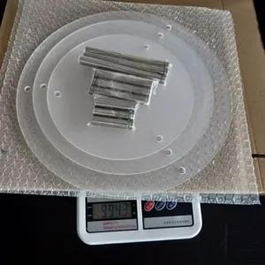 Detailed view of 3 tier clear acrylic cake stand with metal pillars showing product weight.