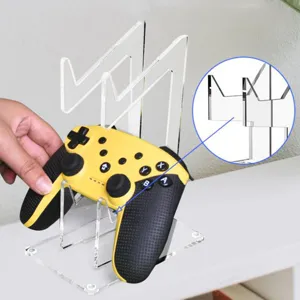 Transparent acrylic dual game controller stand desktop storage display rack for PS4 controllers.