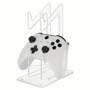 Clear acrylic dual controller stand detail, transparent desktop mount for gamepads, modern storage.