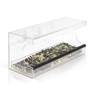 Clear acrylic window bird feeder detail showing transparent material and suction cup mount structure.