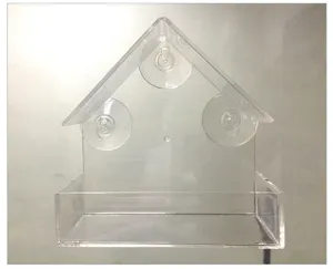 Comedero para pájaros de acrílico transparente en forma de casa con fuertes ventosas detalle.