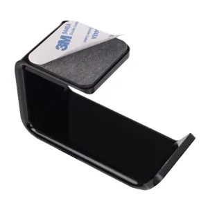 Close-up view of the black acrylic headphone holder showing 3M adhesive backing detail.