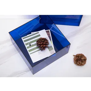 Blue transparent acrylic desktop storage box detail, modern minimalist design, clear display.
