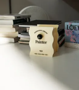 Close-up detail of aesthetic wavy acrylic desktop storage box and pen holder in beige.