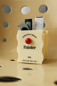 Acrylic desktop storage box with red ball decor, cute wavy edge pencil and remote holder.