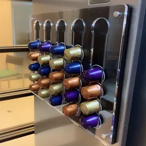 Acrylic wall-mounted coffee capsule holder display rack for home office kitchen use.