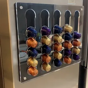 Acrylic coffee pod holder detail view, wall mounted capsule storage rack for kitchen office.