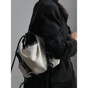 Dark cool style convertible backpack with metallic zippers and leather straps for women.