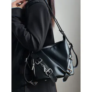 Black multi-use punk style leather backpack with silver hardware and versatile straps.