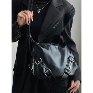 Dark style multi-purpose soft leather shoulder bag and backpack with metal buckles.