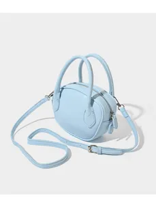 Light blue mini bowling bag detail, sleek leather texture, metal hardware and shoulder strap.