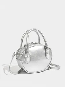 Minimalist silver shell bowling bag, versatile large capacity handbag for women stylish daily use.