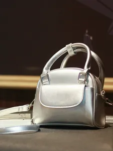 Silver leather handbag for women, retro top handle shell bag with detachable crossbody strap.