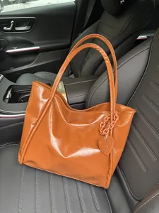 Brown soft leather tote bag for women, large capacity shoulder bag with heart pendant.