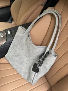 Grey soft leather tote bag with heart charm, stylish large capacity shoulder bag for women.