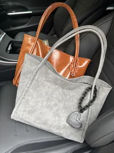 Soft leather large capacity tote bag with heart charm, stylish shoulder handbag for daily use.