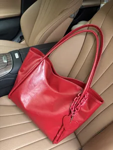 Red soft leather tote bag with heart charm, large capacity stylish shoulder bag for daily.