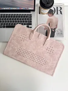 Pink laptop sleeve handbag with perforated design, sleek business style protective case for work