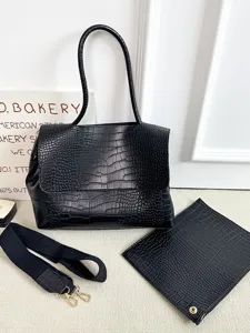 Schwarze Krokodilmuster Handtasche aus Leder mit breitem Gurt und Beutel, große shopper tas.