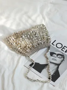 Silver metallic beaded woven handbag, stylish shoulder underarm commuter bag for women.