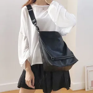Detail view of the large capacity black crossbody bag with chain strap, perfect for daily wear.