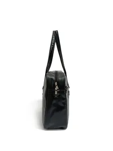 Side profile detail view of black PU leather JK uniform bag showing spacious compartment.