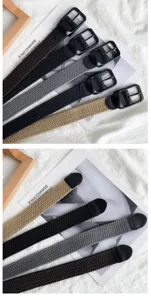 Detailed view of woven stretch belt with matte black buckle, casual minimalist fashion style.