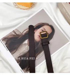 Minimalist dark brown thin leather belt detail, classic square metal buckle design.