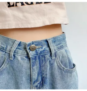 Detailed view of women denim jeans high waist design with metal button decoration casual wear