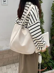 Minimalist beige large capacity shoulder tote bag, stylish versatile leather underarm bag.
