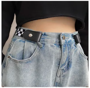 Close-up detail of buckle free elastic waist belt with black and white checkered pattern.