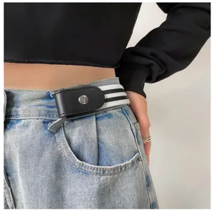 Close-up detail of the buckle-free elastic waist belt worn on denim jeans, stylish and practical.