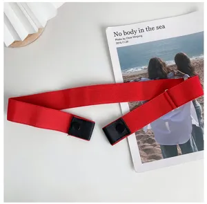 Red elastic belt detail showing buckle-free design and soft stretch fabric for daily wear.