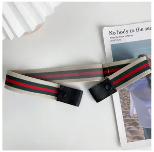 Detail shot of buckle-free elastic belt with classic stripe pattern, adjustable and stretchable.