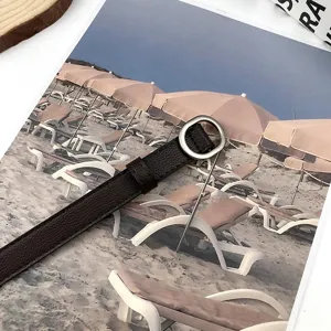 Dark brown textured leather thin belt with small oval metal buckle for women dress shirt