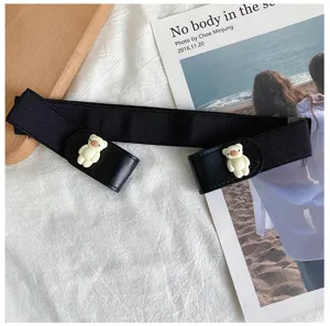 Details of black elastic waist belt featuring cute white bear buckle and soft fabric texture.
