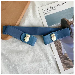 Detail shot of blue elastic lazy belt with cute white bear decor for stylish jeans and dresses.