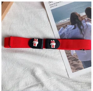 Red elastic waist belt detail view featuring cute cartoon rabbit decorative buckle, stretch fit.