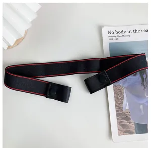 Black elastic invisible lazy belt with red line detail, buckle-free casual jeans waist strap.