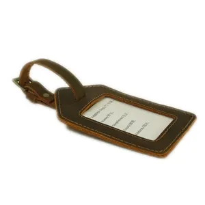 Vintage genuine leather luggage tag with metal buckle and clear ID card window for travel bags.