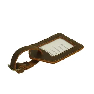 Vintage genuine leather luggage tag detail, top grain cowhide bag pendant with ID card window.